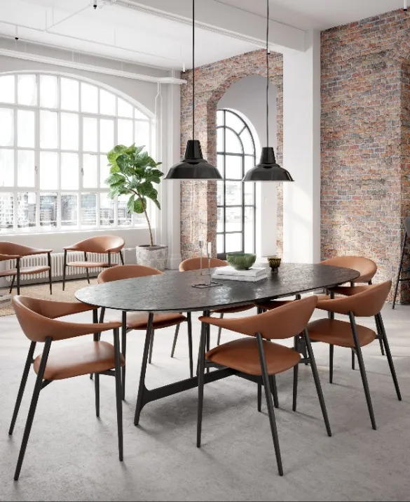 DAN-FORM's ROVER armchairs around the OOID table in a New Yorker home